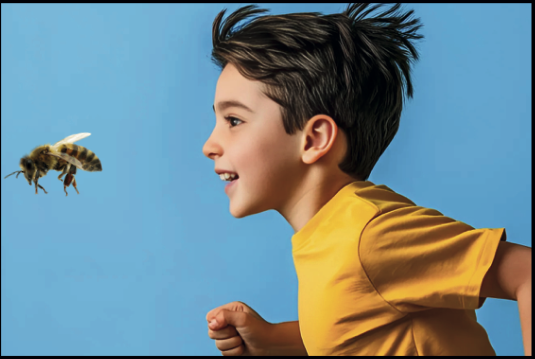 Boy chasing bee